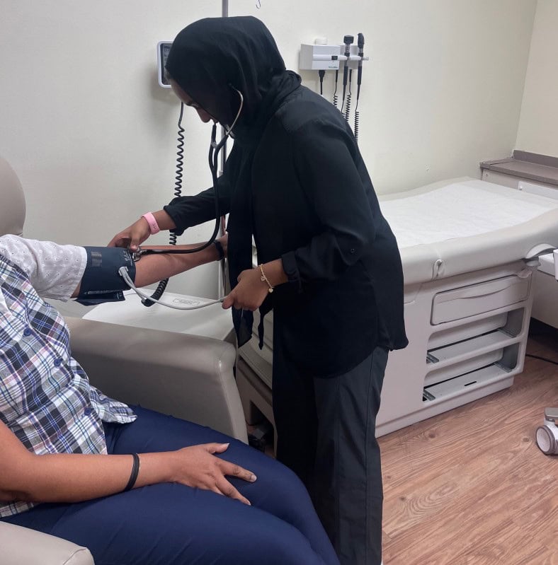 A person in a hospital helping